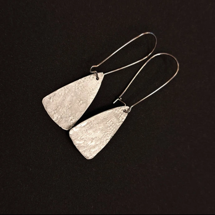 création d'élève boucles d'oreilles